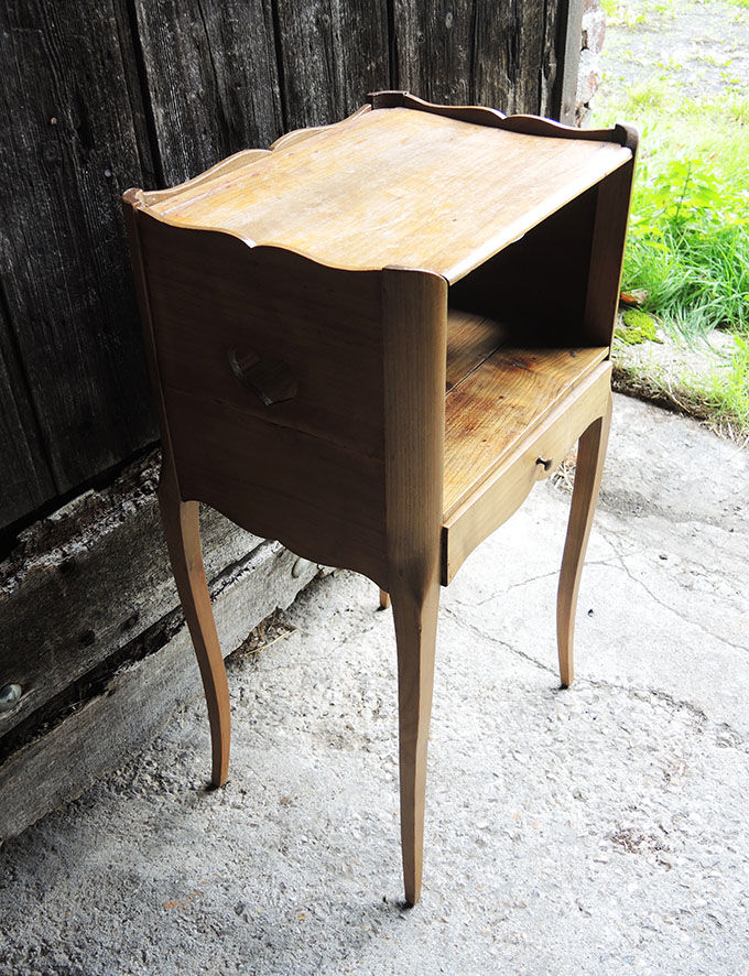 Old wooden bedside table heart pattern