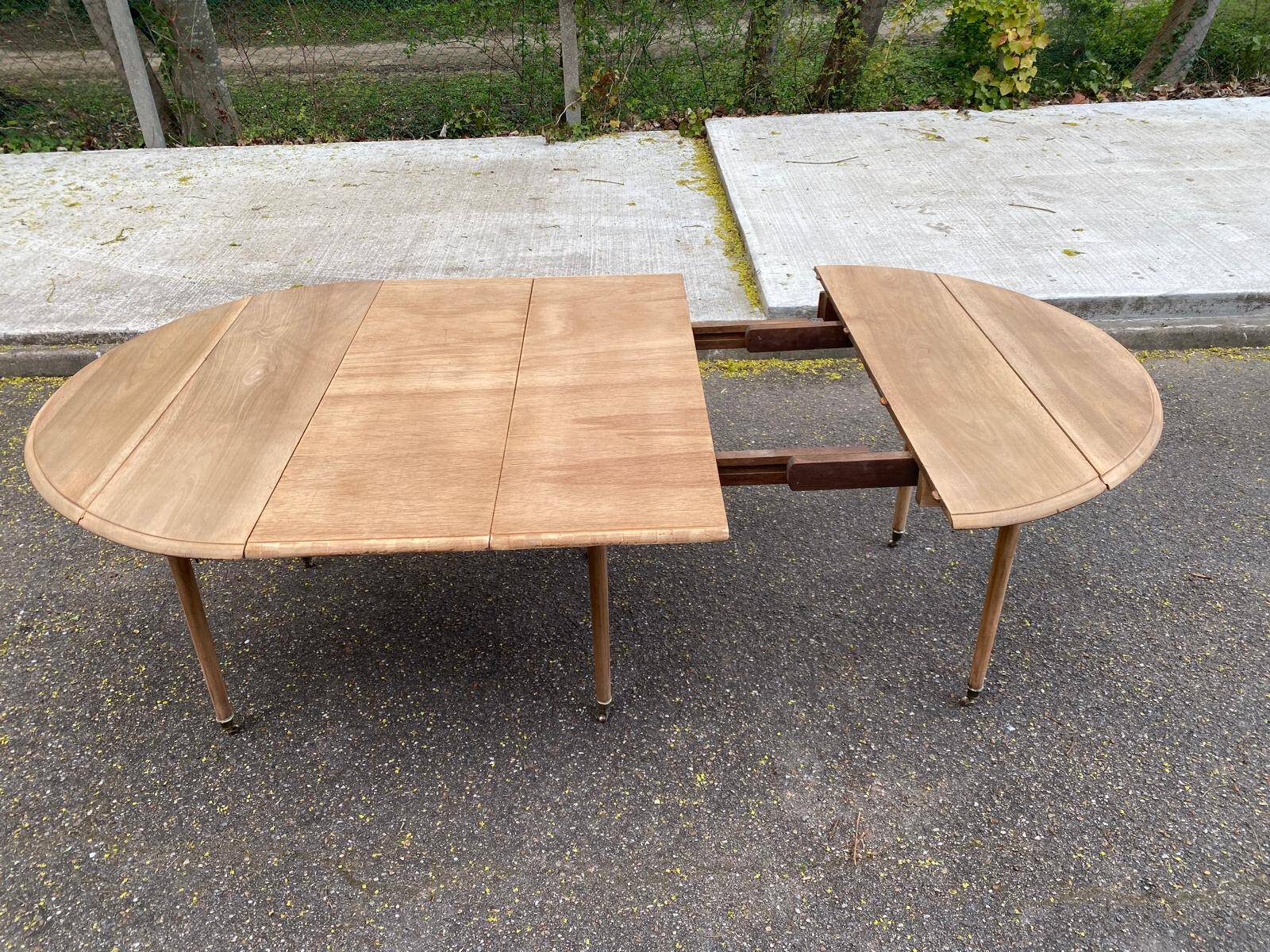 Renovated Louis Philippe round extendable dining table with leaves from the 18th century.