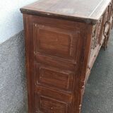 Old wooden console with chains