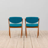 Pair of 42 Kai Kristiansen teak chairs in original blue bouclé upholstery, Denmark, 60s.