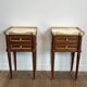 Pair of mahogany and brass side tables or bedside tables with Carrara marble tops.