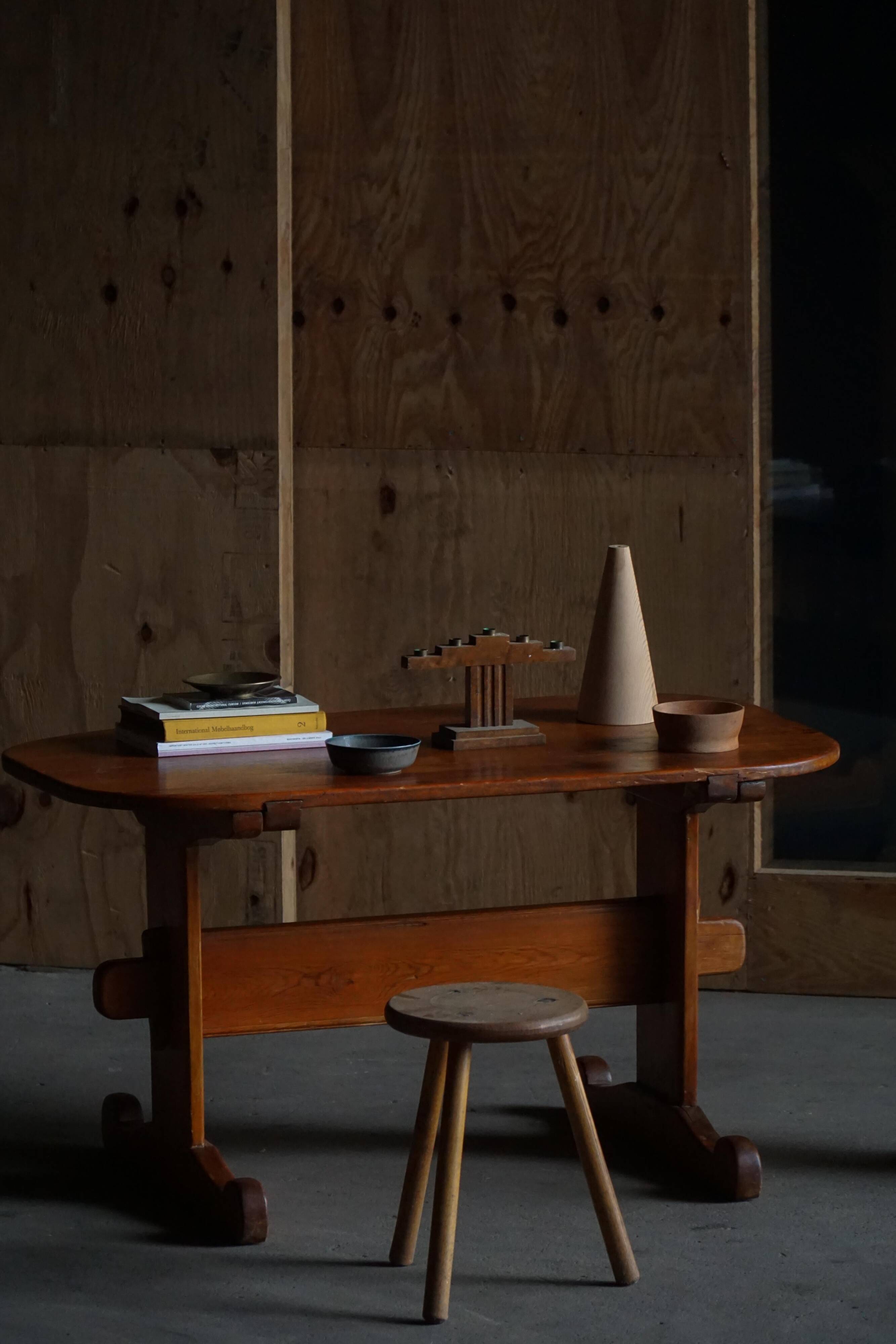 Primitive Swedish oval dining table in pine, early 20th century.