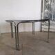 Round chrome and smoked glass coffee table