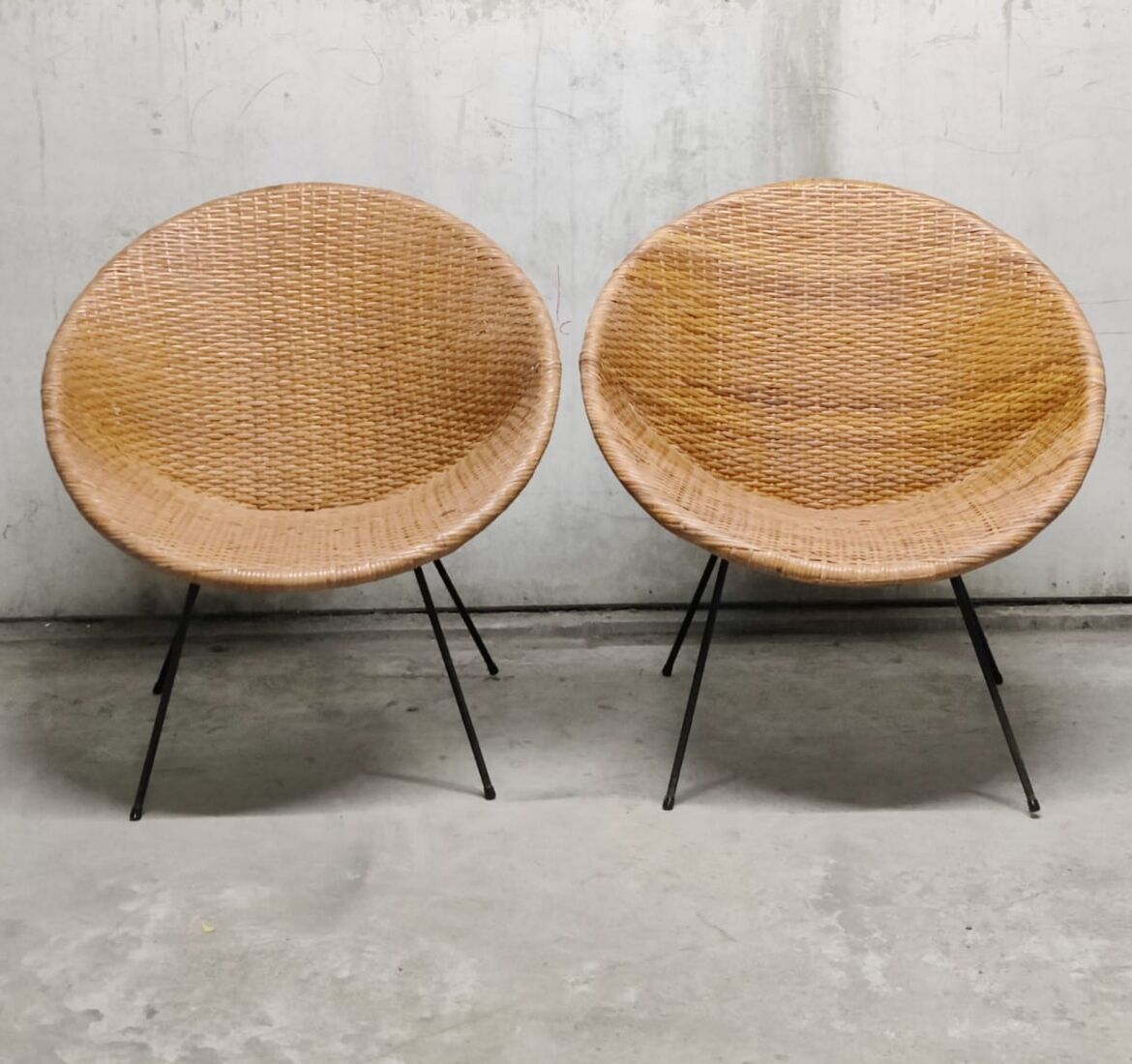 Pair of braided rattan armchairs