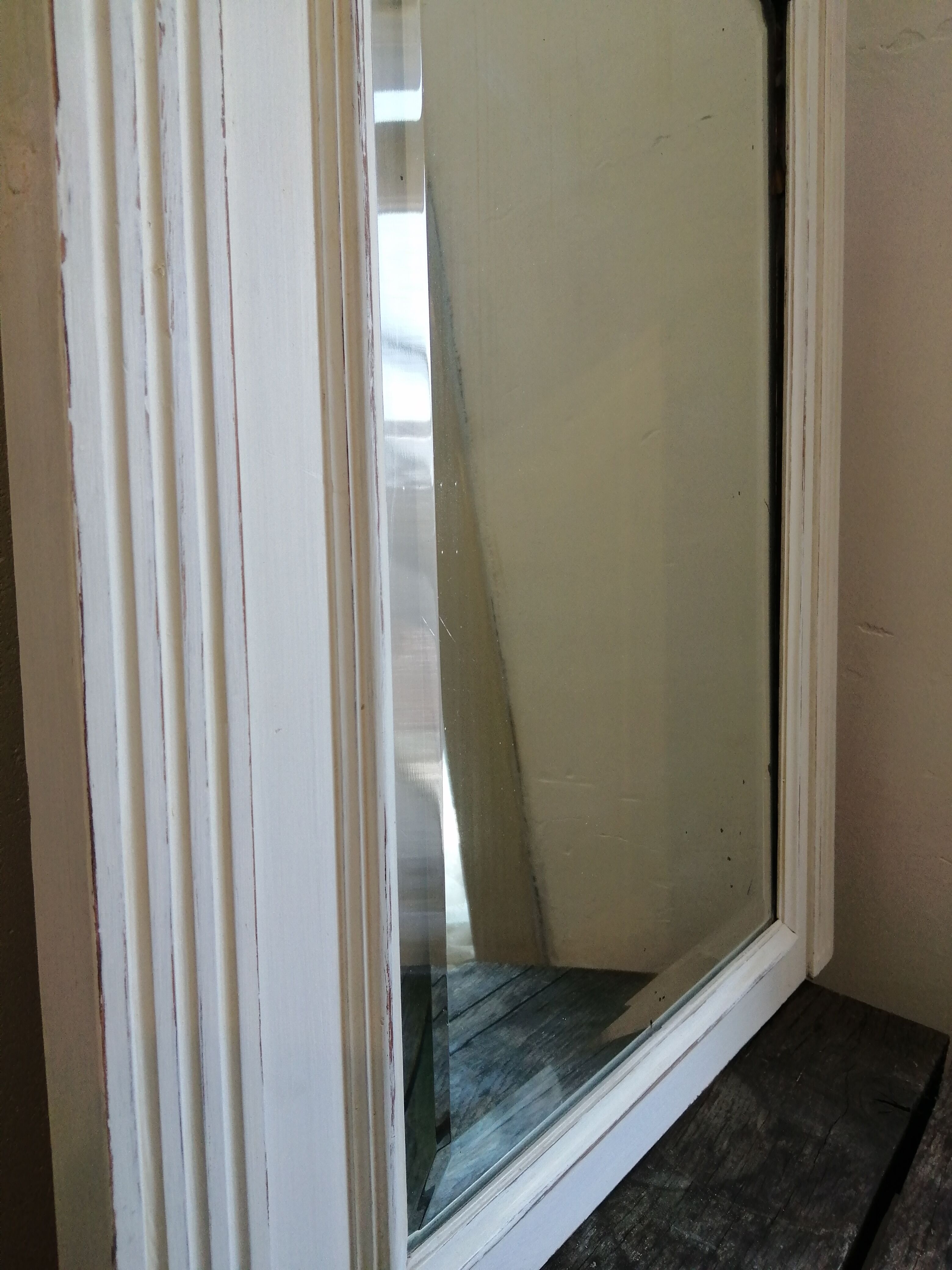 Beveled fireplace mirror