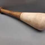 Imposing ancient ceramic pestle and wood