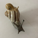 Porcelain figurine snail and its small