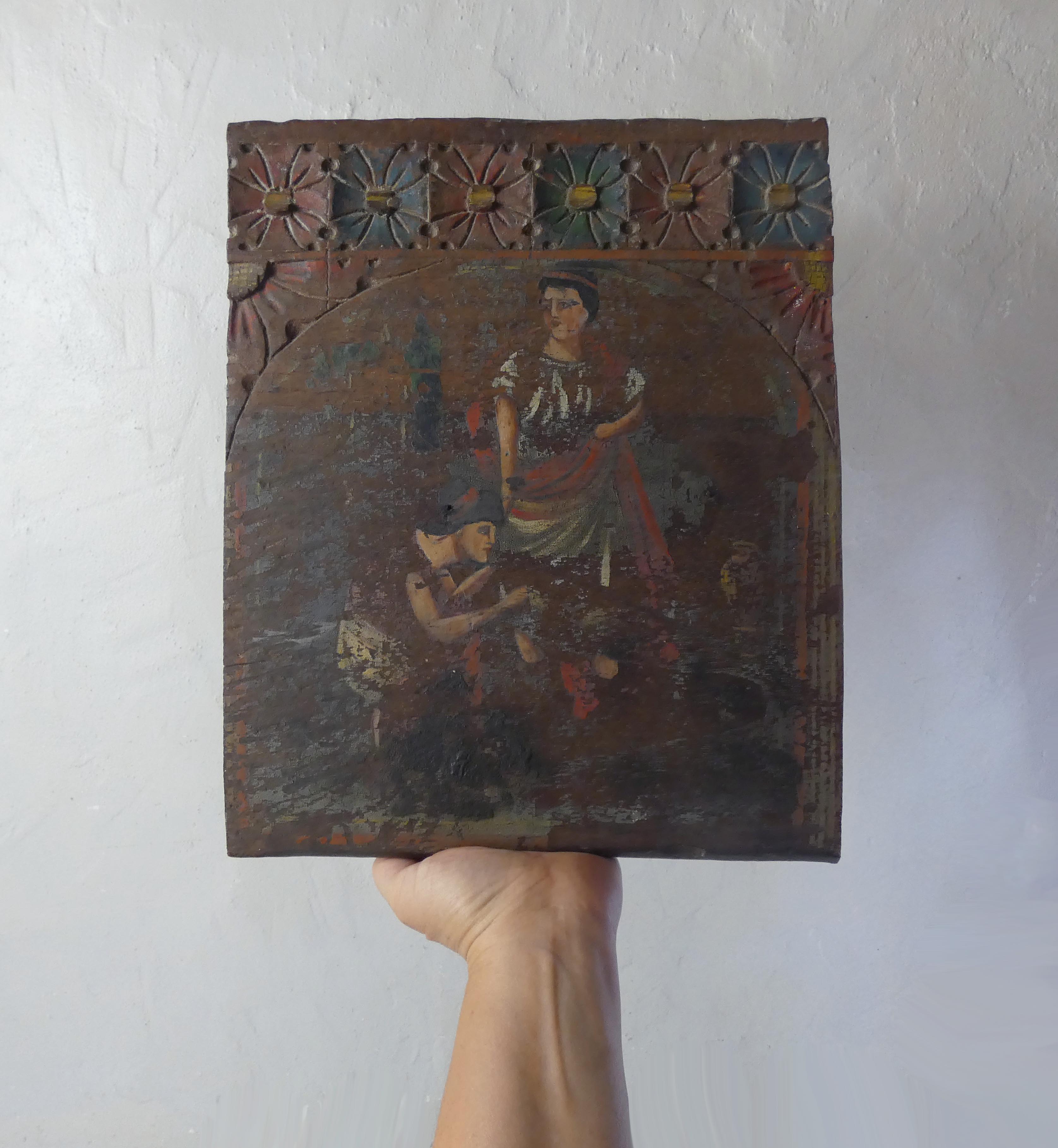 Painting on carved wood panel