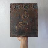 Painting on carved wood panel