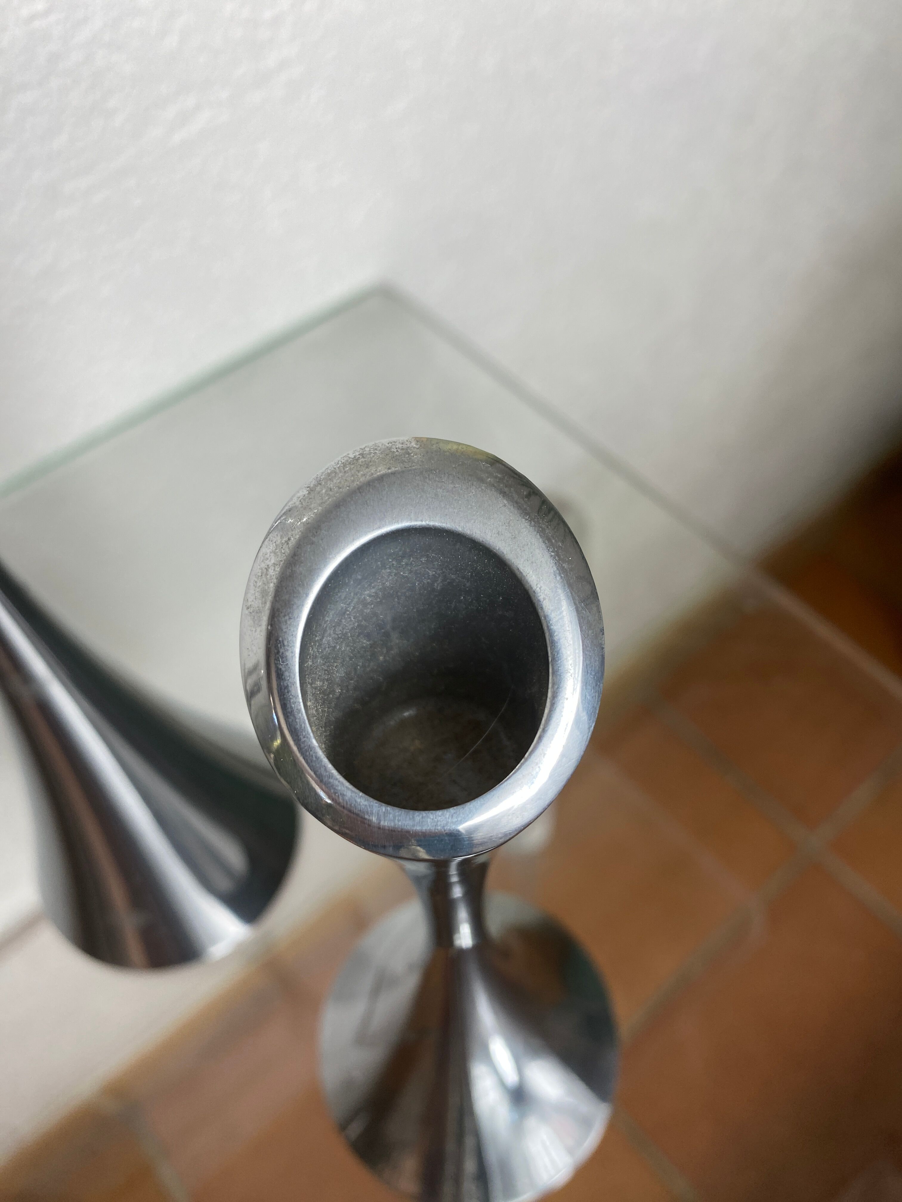 Pair of designer candle holders in stainless steel