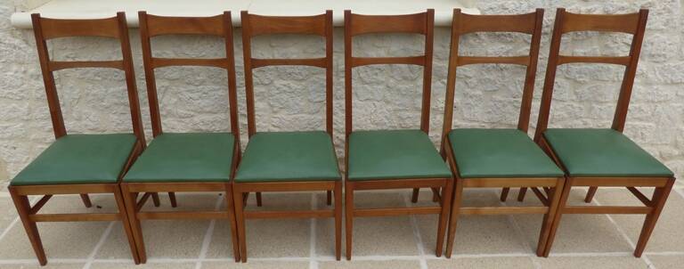 6 modern chairs with banded backs and green faux leather seats