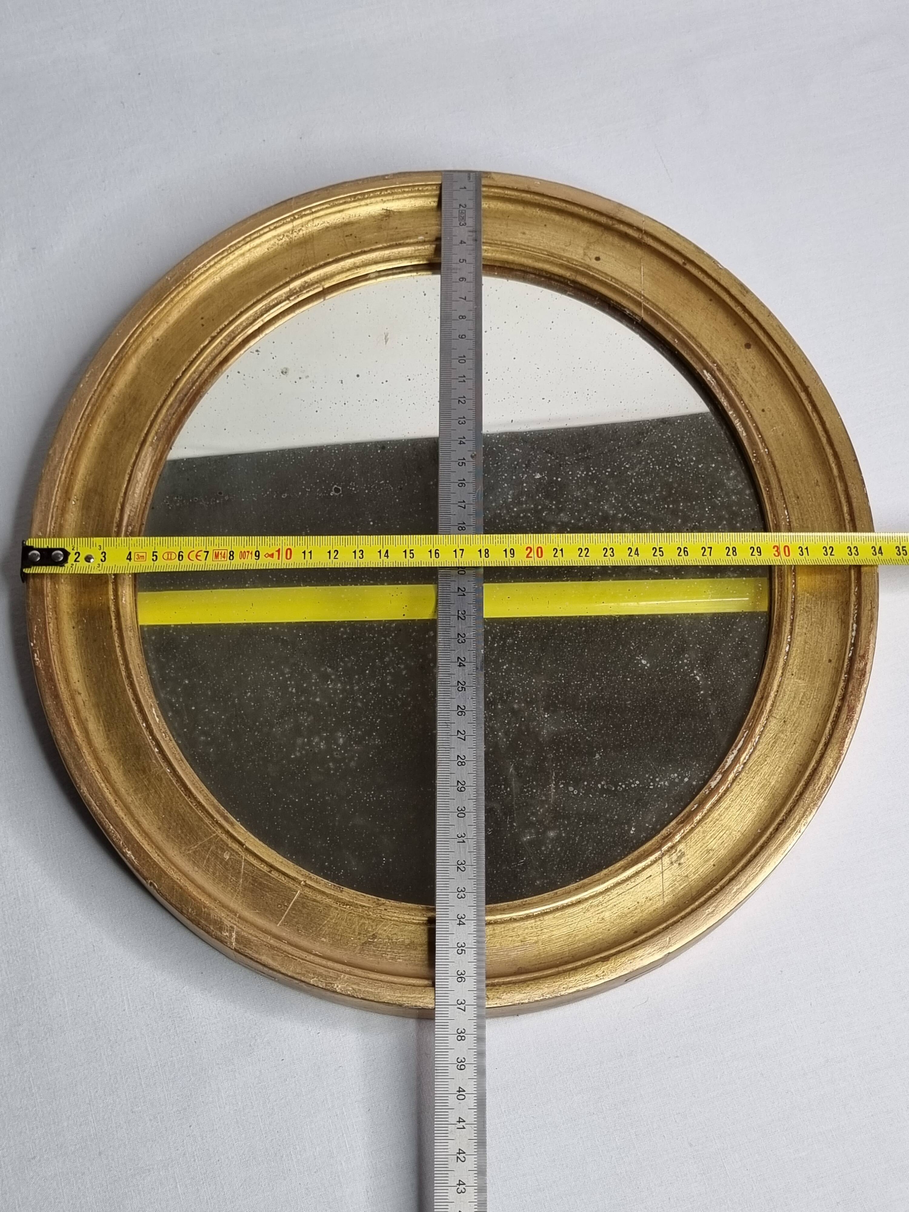 Antique round mirror in gilded wood, original patinated glass from the 19th century, 34 x 37 cm.