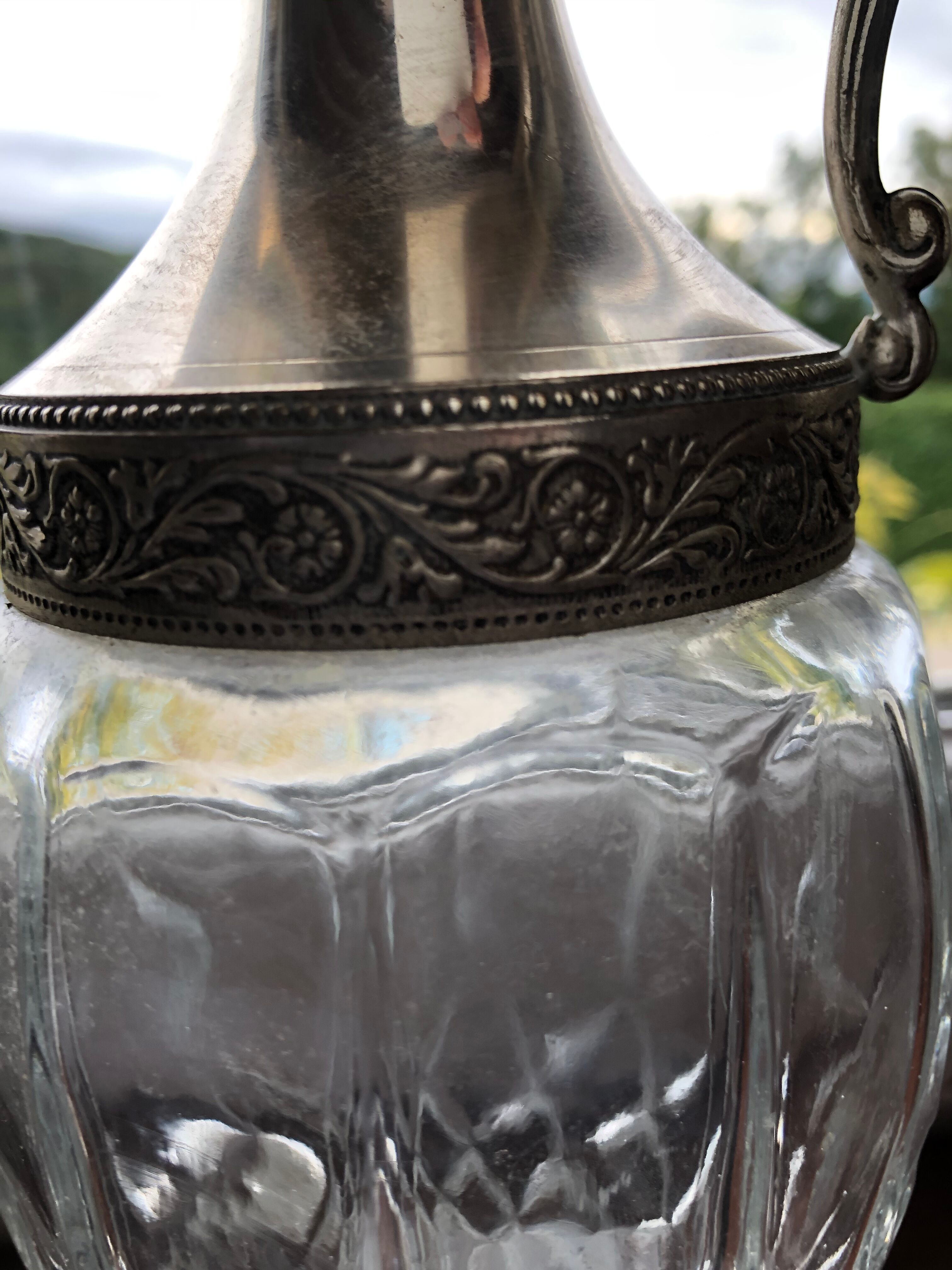 Pair of glass and silver metal ewers