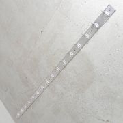 Wall-mounted aluminium coat rack of 225 cm with 16 double hooks, 1960s.