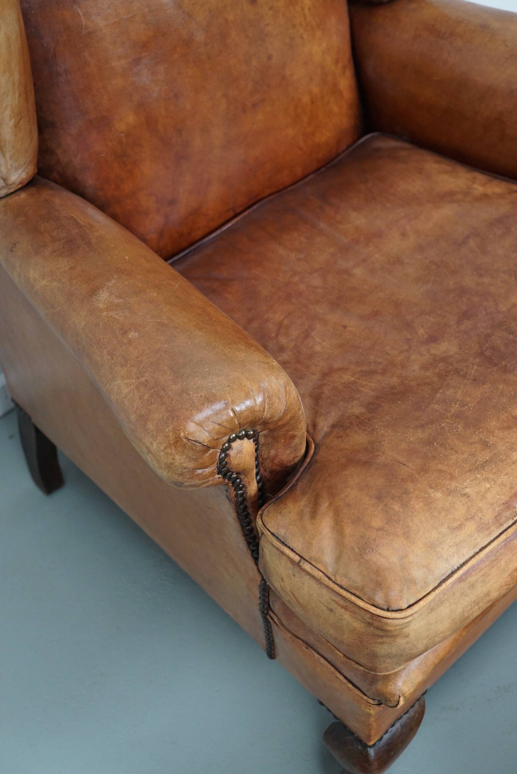 Vintage Dutch cognac coloured leather club chair, with footstool