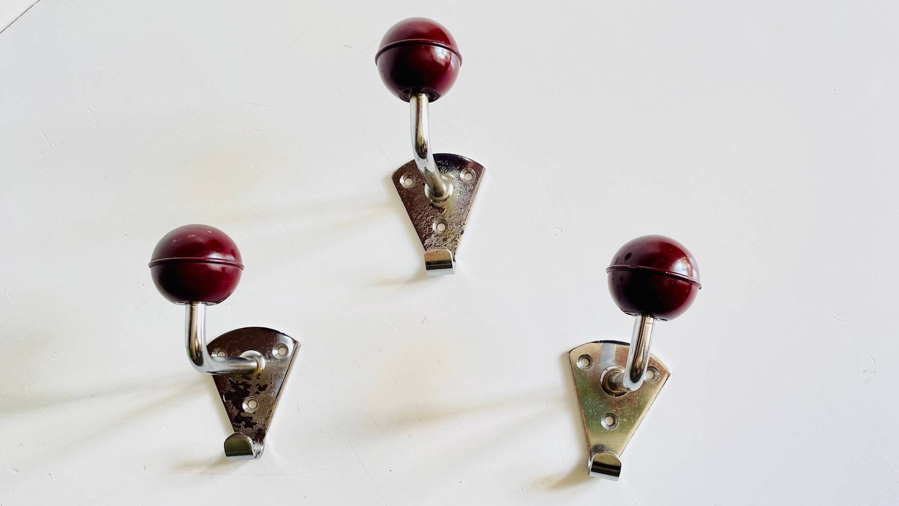 Chrome and bakelite coat hooks from the 70s