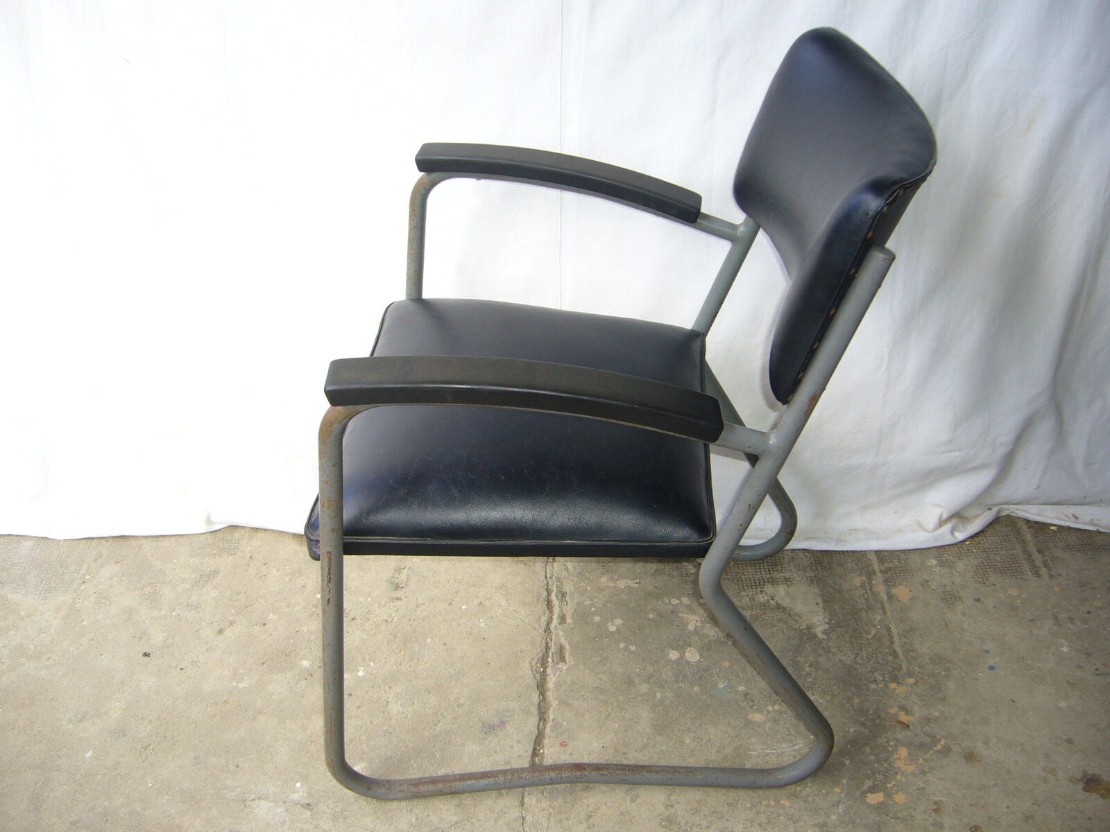 Old industrial chair in skai and metal