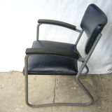 Old industrial chair in skai and metal