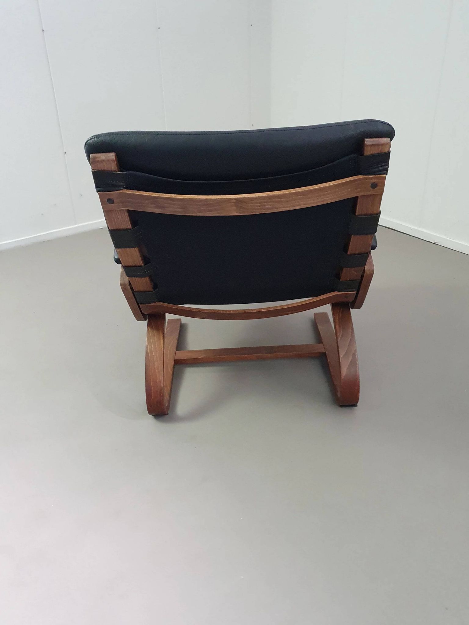 2 x Scandinavian black leather lounge chairs