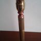 Pair of b-shaped brass legs in the shape of a column