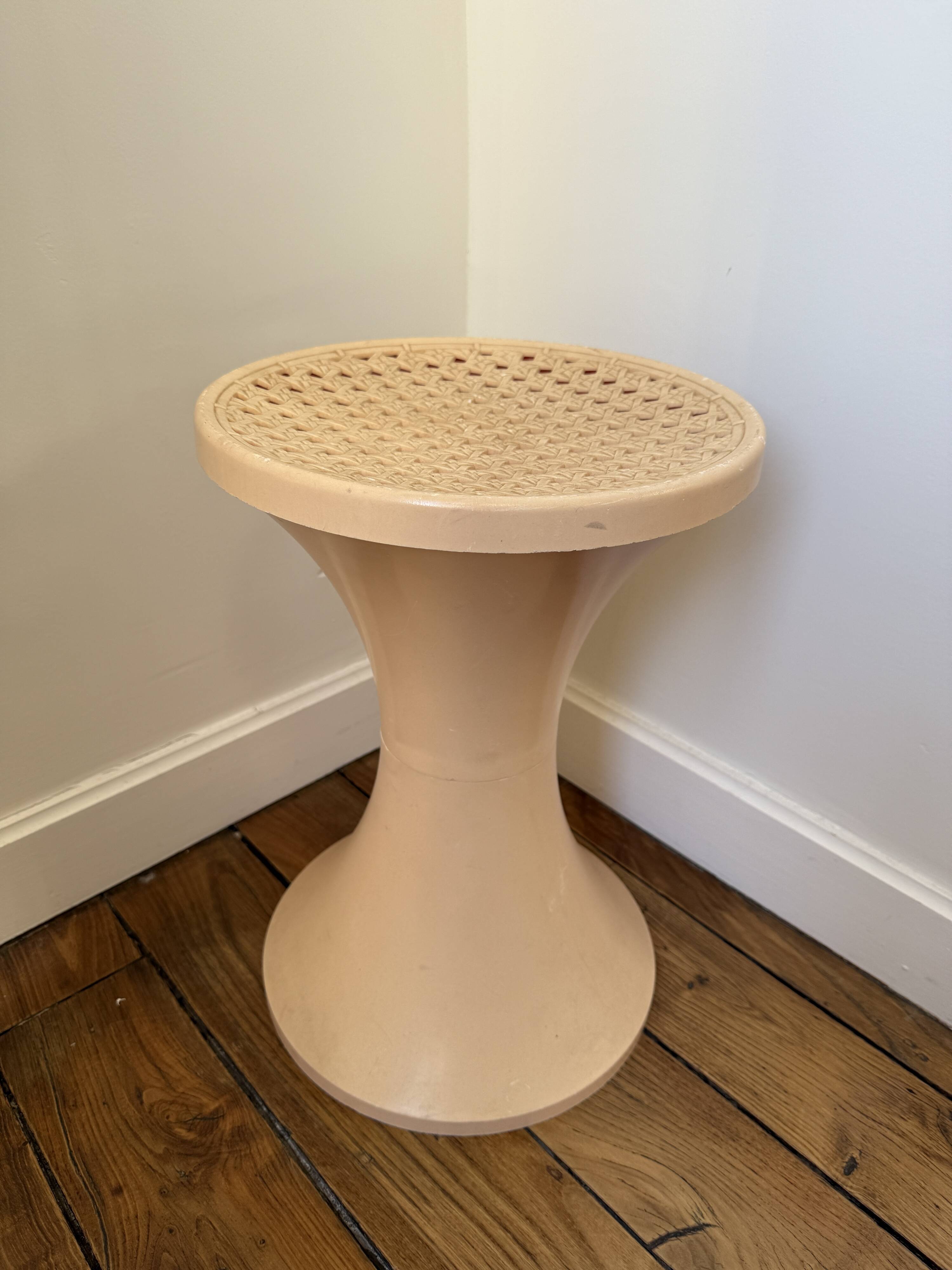 Tam Tam Stamp stool Made in France with a woven rattan-style seat.