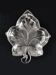 Leaf-shaped pocket tray in minimalist silver plating.
