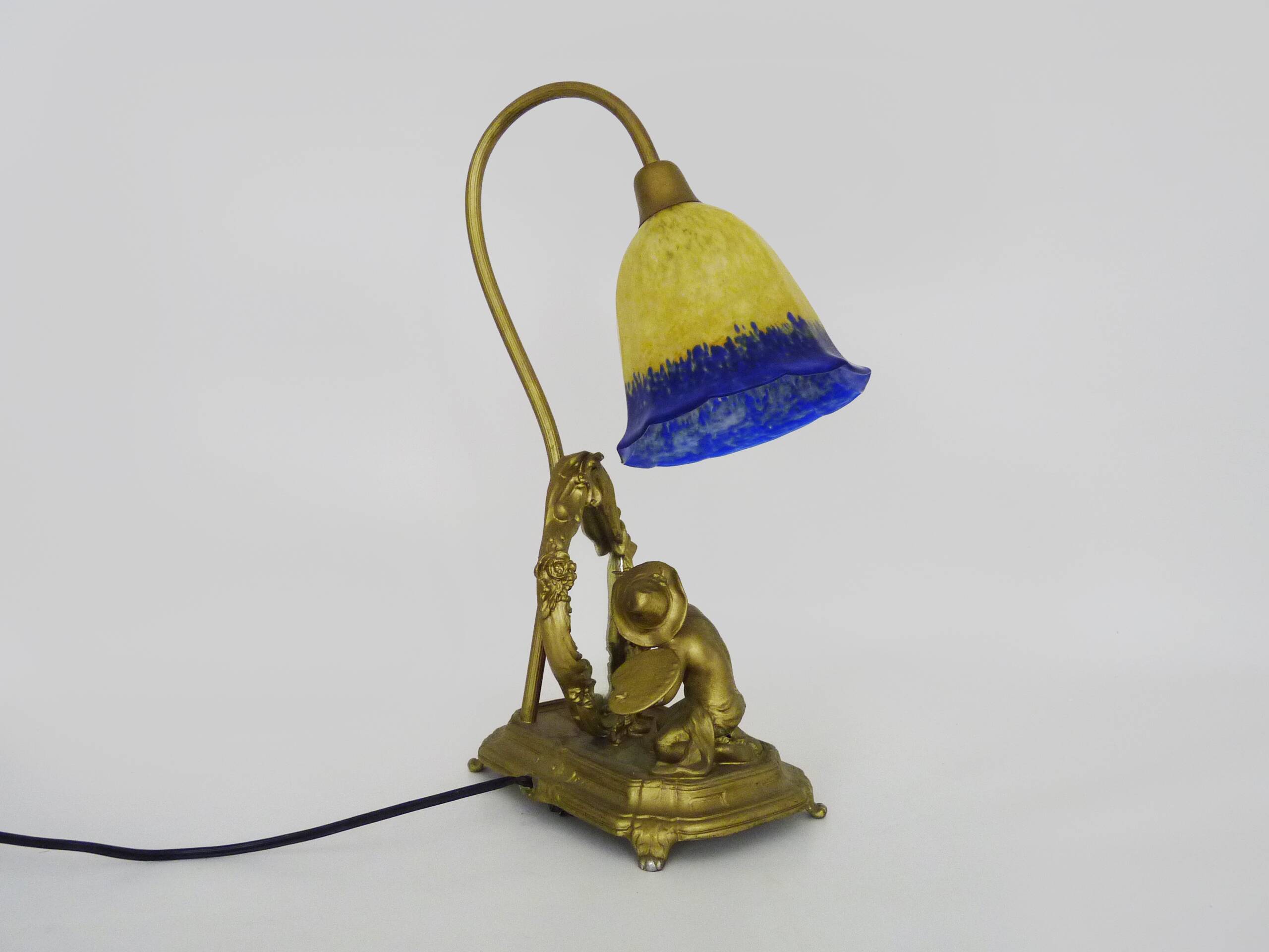 Vintage bronze table lamp featuring a painter on a mirror from the 1960s.