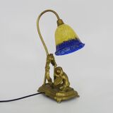 Vintage bronze table lamp featuring a painter on a mirror from the 1960s.