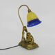 Vintage bronze table lamp featuring a painter on a mirror from the 1960s.