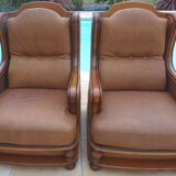 Pair of aged leather armchairs with seat and firm backrest with cherry wood frame