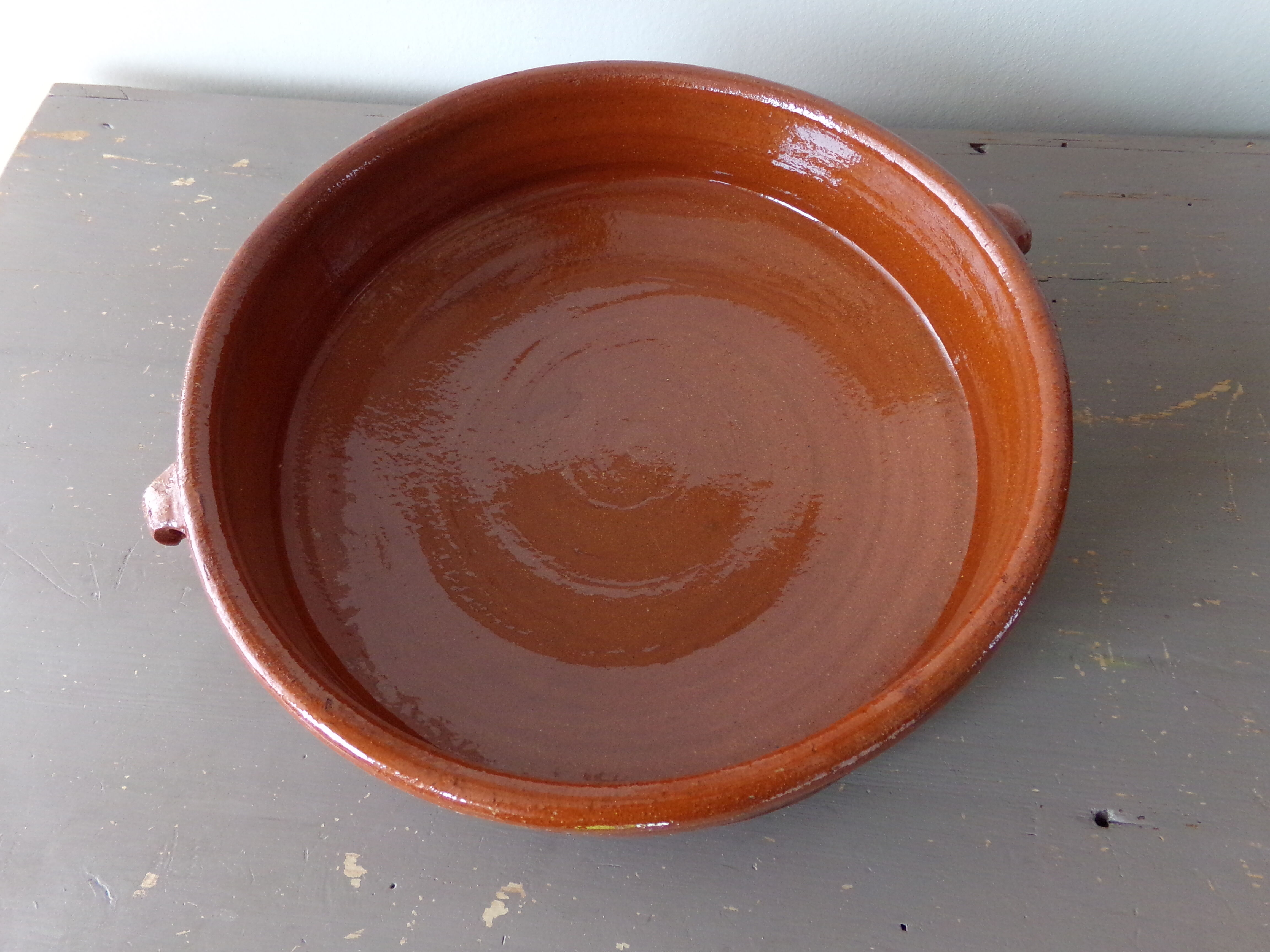 Antique dish in glazed terracotta