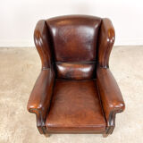 Vintage dark brown sheep leather wingback armchair
