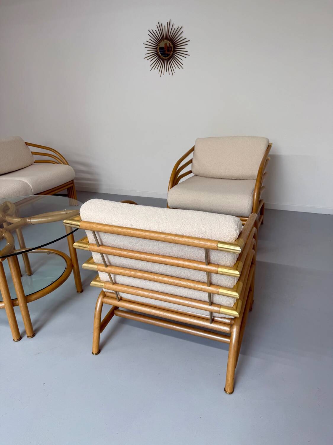 Complete living room with rattan sofa and white bouclette, brass finish, 80's design