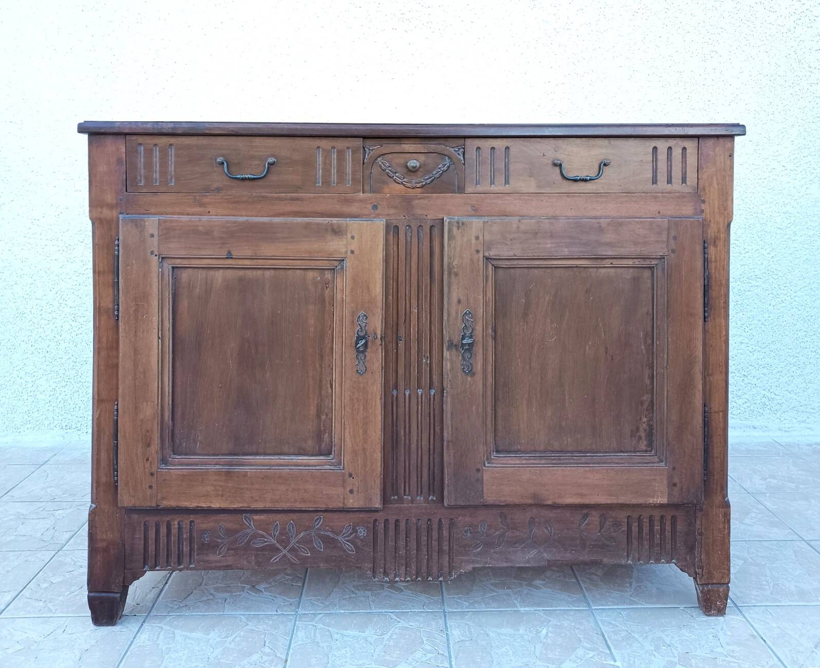 Louis XVI walnut buffet from the 19th century.