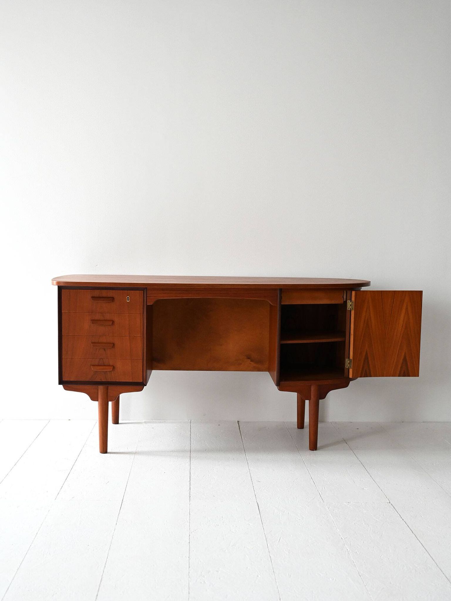 Scandinavian oval desk in teak from the 1960s.