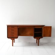 Scandinavian oval desk in teak from the 1960s.