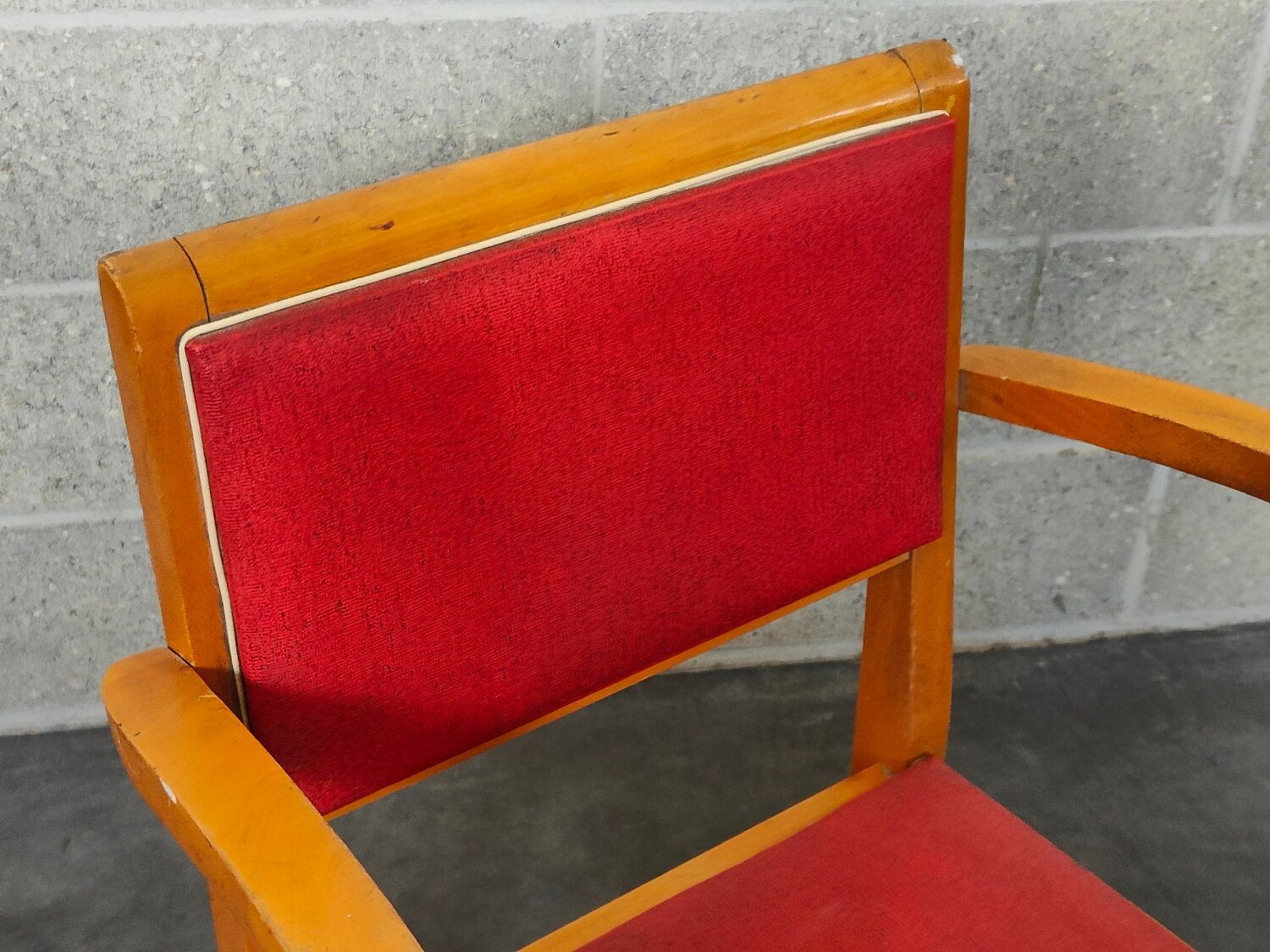 Small red bridge chair with armrests