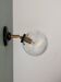Vintage glass globe wall light with a cracked effect.