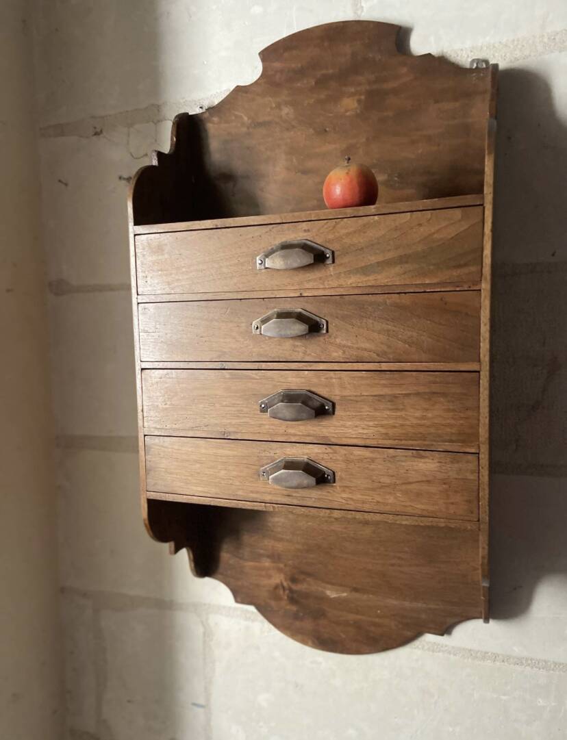 Antique piece of furniture with walnut drawers to hang