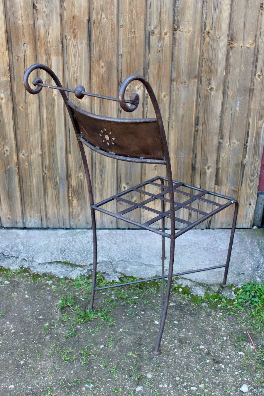 Series of 8 wrought iron garden chairs