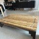 Coffee table in travertine with mother-of-pearl inlays.