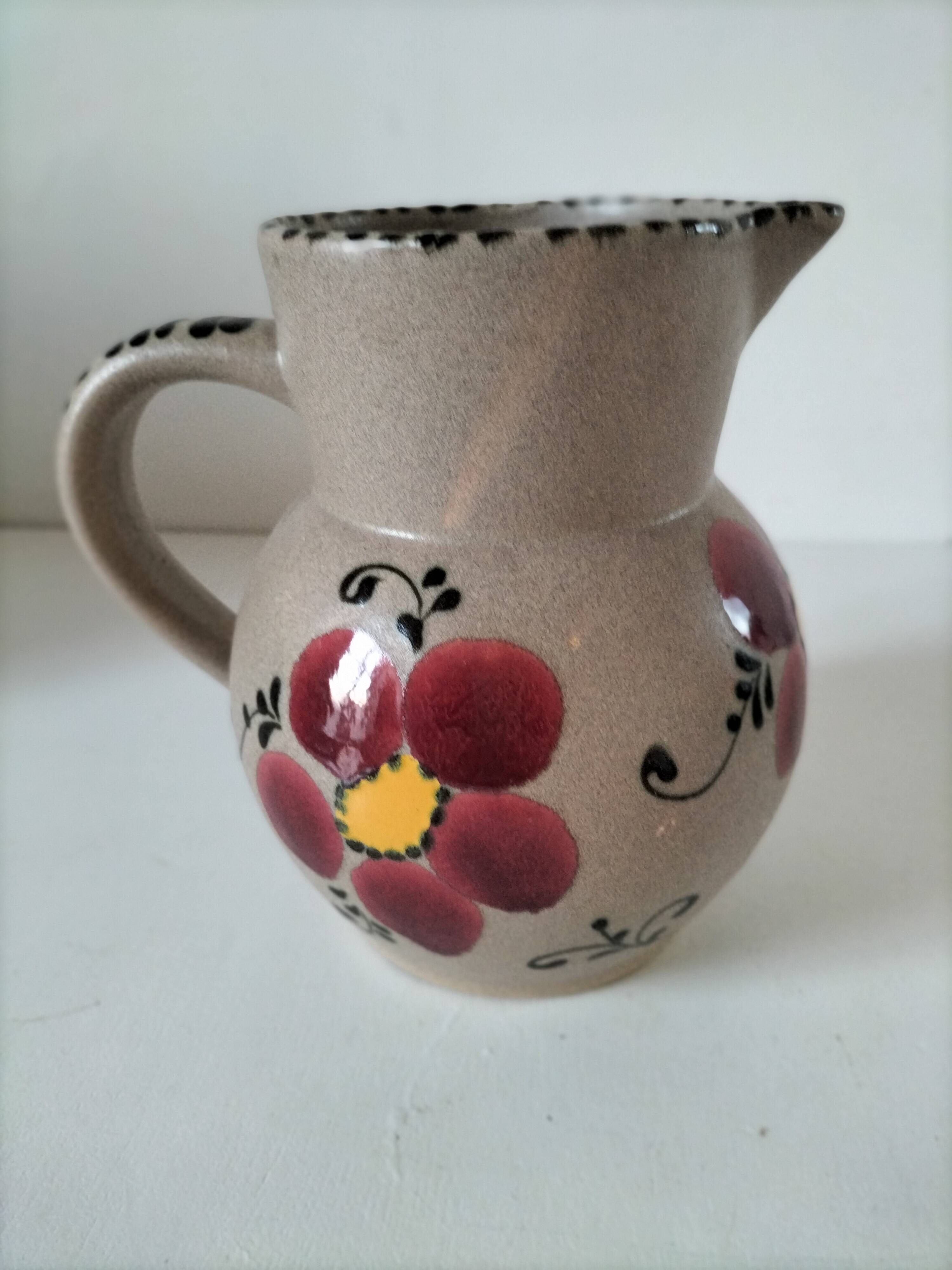Vintage stoneware pitcher with hand-painted floral decoration, 1960s–70s