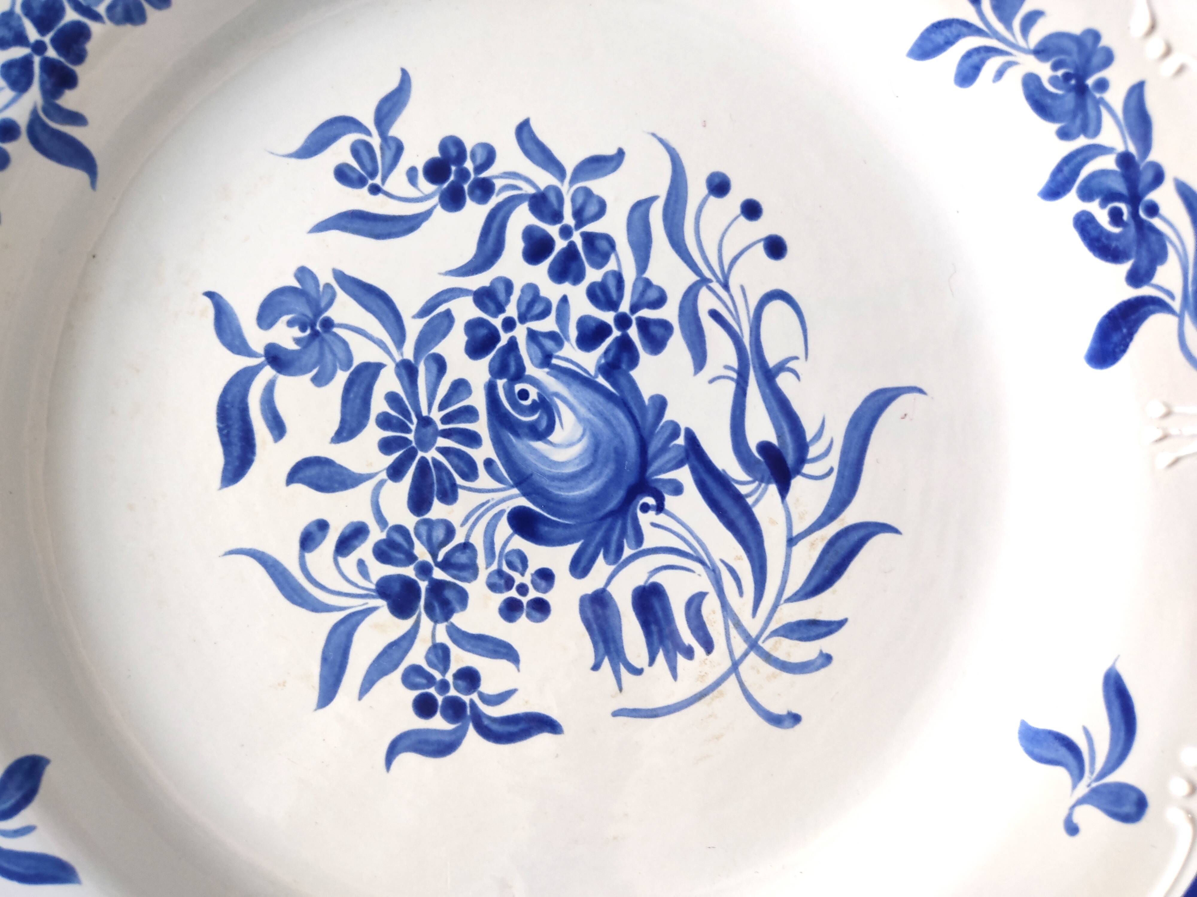 Decorative blue and white earthenware plate
