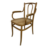 Curved wood and cane armchair