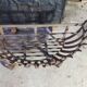 Wrought iron log holder in the shape of a semicircle - 20th century