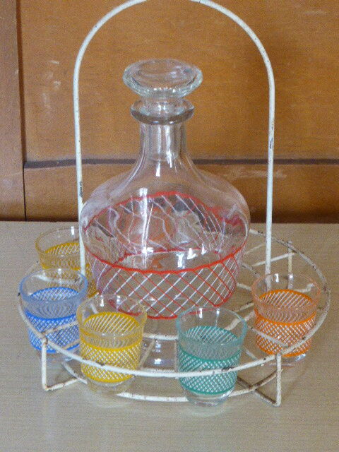 Service a Liqueur consisting of a metal servant, a carafe and 6 small vintage glasses 1950