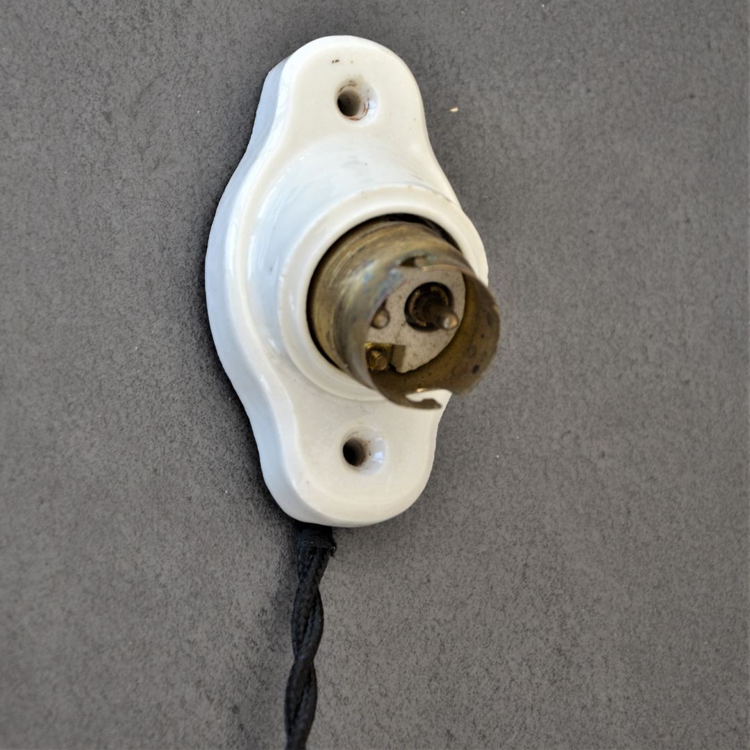 Oval porcelain hook to plug into socket