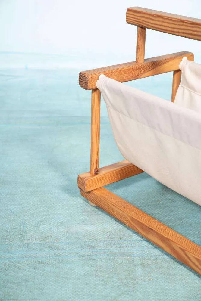 Bohemian magazine rack in vintage 70s pine style.