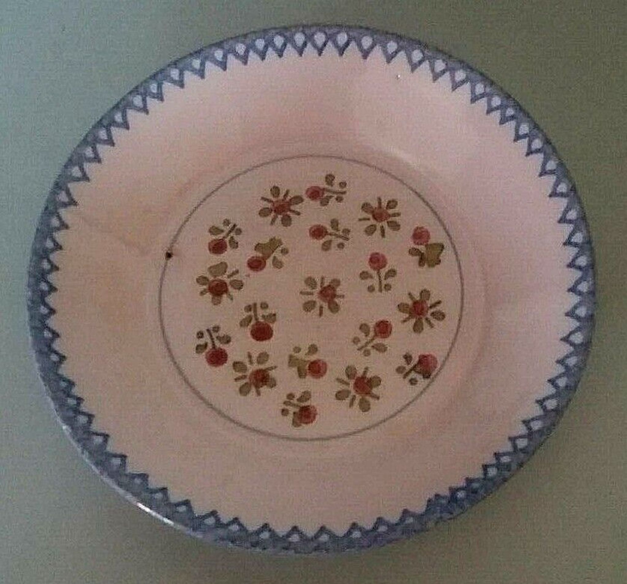 Hollow plate in earthenware, early twentieth century