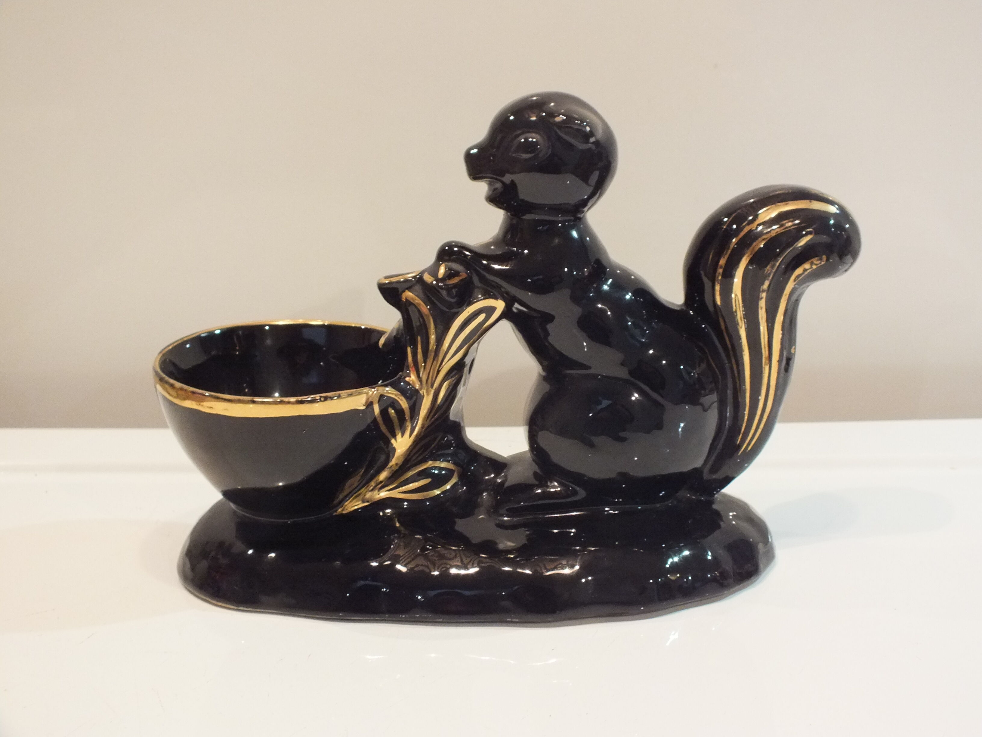 Black and gold ceramic squirrel pot cache from the 50s